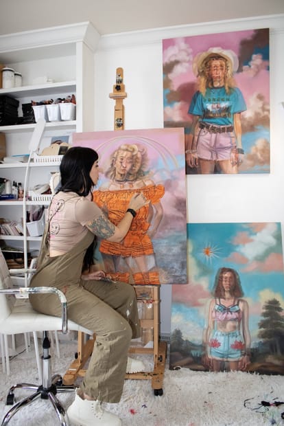 artist Alex Garant in her studio painting