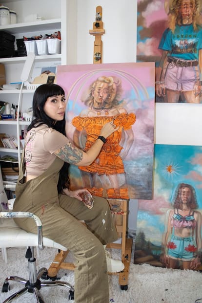 artist Alex Garant in her studio painting
