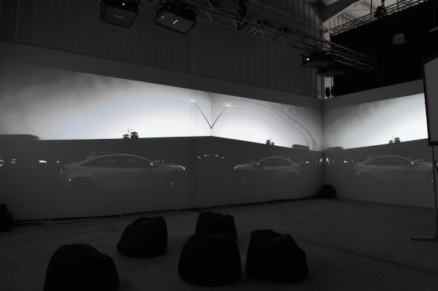 Sitting in the back seat, a literal secondary space as the vehicle moves forward. My sight obstructed, my view is...