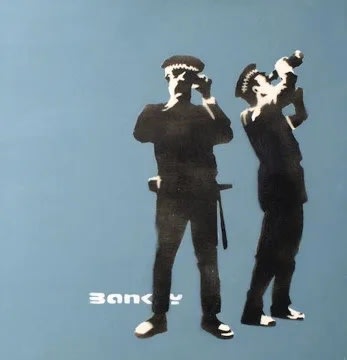 Banksy’s 2001 Avon and Somerset Constabulary reimagines UK police force, satirical institutional portrait.