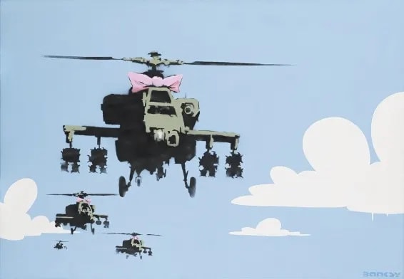 Banksy’s 2005 Happy Chopper helicopter with bow, blending warfare and innocence in stark contrast.