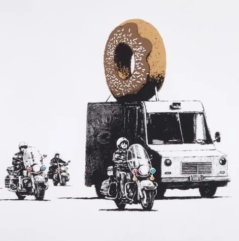 Banksy’s 2009 Donut van chased by police, humorous jab at law enforcement and excess.