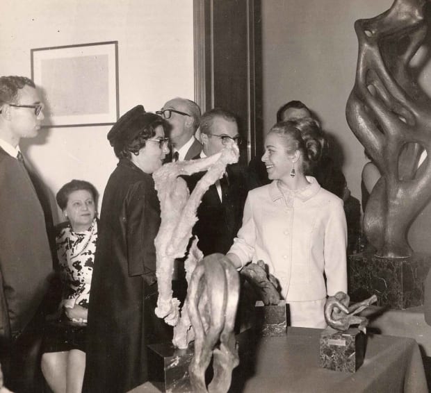 Visitors inspecting Di Modica's early bronzes at Villa Medici, Florence