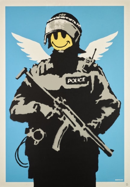 Banksy’s 2003 Flying Copper shows armed officer with smiley face, clash of power and peace.