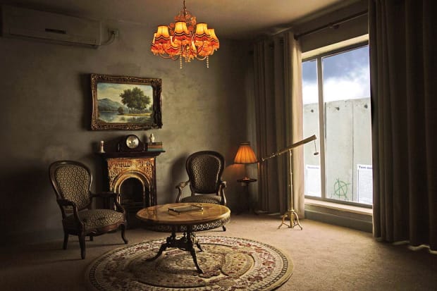 Banksy, Walled Off Hotel – Scenic Room, Bethlehem, 2017 – guest room overlooking the West Bank wall with satirical decor.