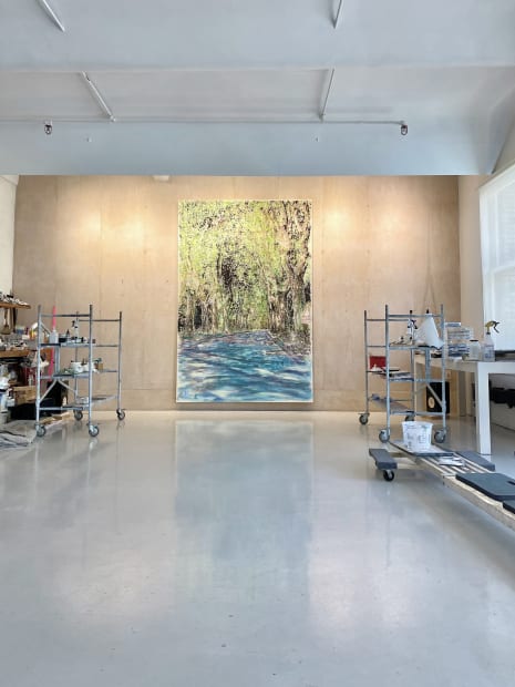 Here, Swansea depicts a tree-lined road winding away from the viewer; the dappled light and open road evoke a feeling...