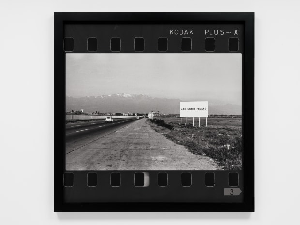 A series of photographs produced between 1979-1981 depict billboards emblazoned with Jaar’s question ¿Es usted feliz? (Are you happy?), part...