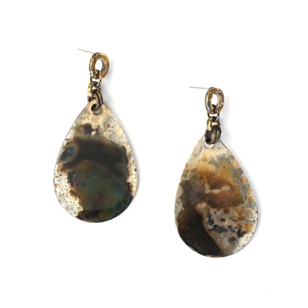 I took these pieces and added unique chains, earring tops and ring shanks from my archive, and behold--a new jewelry...