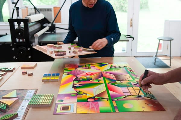 Placing inked woodblocks for Atomic Mystic Particle into jig