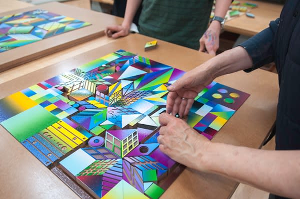 Placing inked woodblocks for Atomic Mystic Particle into jig