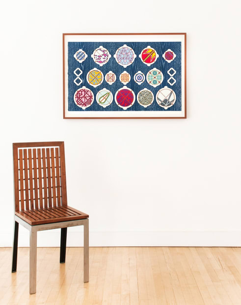 Installation image of the print Love's Great Mystery by Jacob Hashimoto on white wall, next to chair