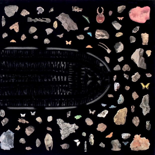 Detail from the left half of Villalongo's diptych showing the bow of the slave ship diagram, rock crystals and African statuary against a black background.