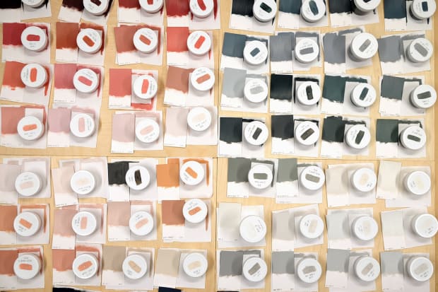 Scott Albrecht mixed paint containers with swatches on top