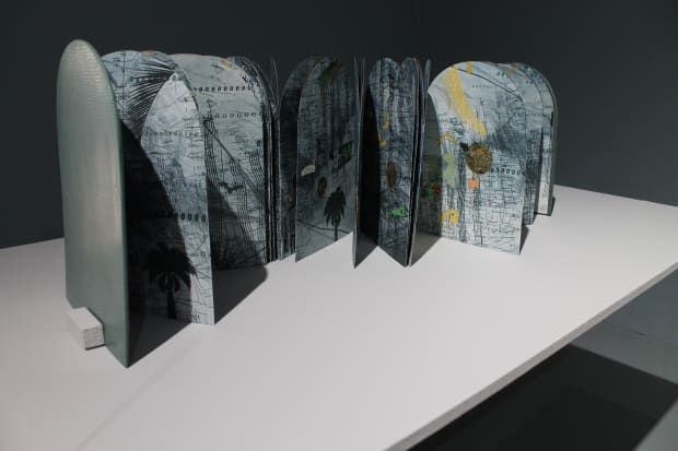 Tammy Nguyen exhibits four artist books that interact with the howling, echoing sound of the letter “O” and further the...