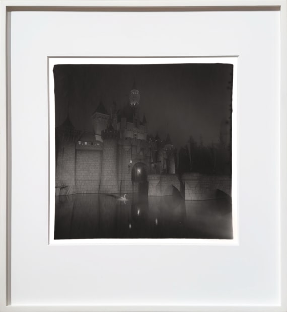 castle at Disneyland at night with swan