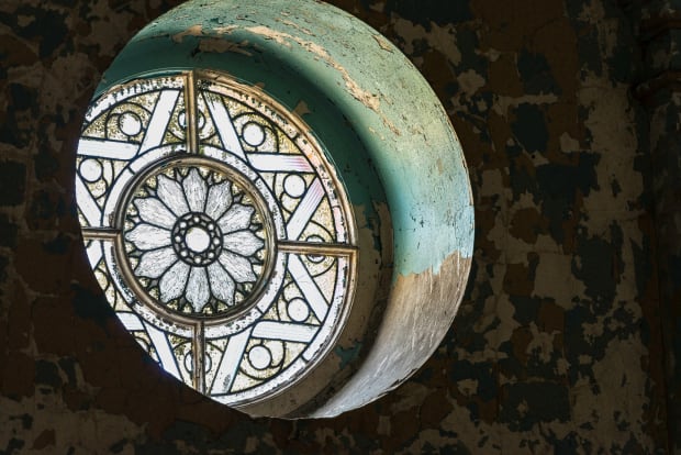 The ornate window was built in 1898 and measures approximately 3 feet in diameter. Situated high and without reach in...