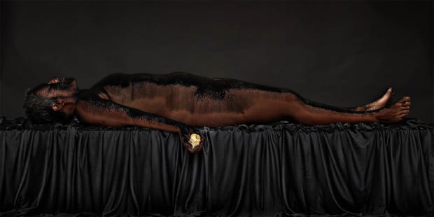 In the triptych To hear, to see, to speak (2014), Searle sprinkled coal dust over her body. The work was...