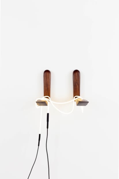 The human body is also present throughout Staros&rsquo; practice. In Sleight of Hand, wall-mounted walnut arms cradle a delicate knot...