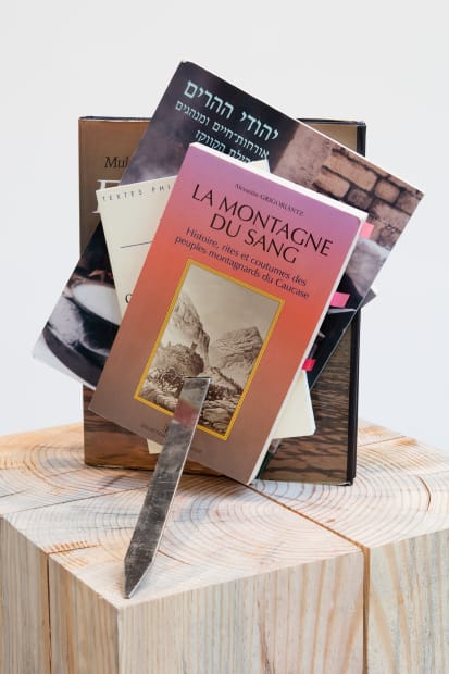 detail of books with skewer through them