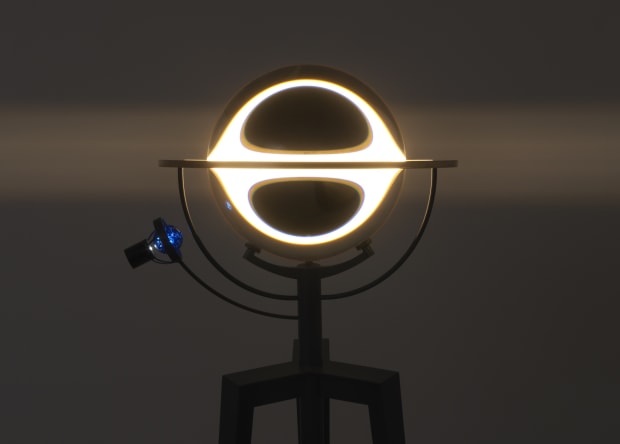 Under the upper gallery skylight, Model for decelerated light, 2021, picks up on Eliasson’s long-standing interest in navigational instruments, compasses,...