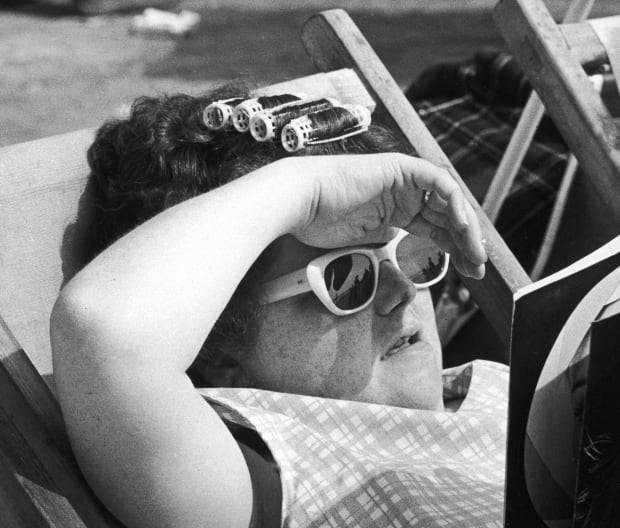 “Pen F 1⁄2 frame 10mm lens. FP4 film.1/250 f/8”. A sunbather who was obviously preparing herself for a glamorous night...