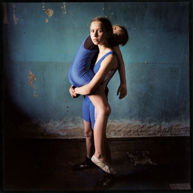 Michal Chelbin Girl Lifting a Girl, Ukraine chromogenic print 37 x 37 inches