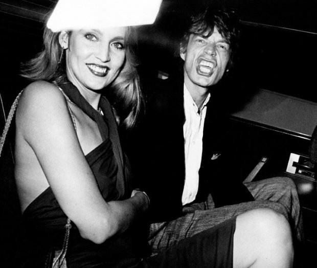 Ron Galella, Mick Jagger and Jerry Hall arrive at a party for Reid Rogers at Limelight, New York, September 19, 1974