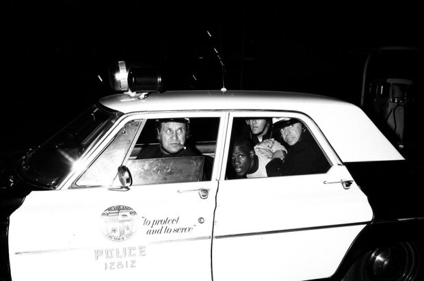 Howard L. Bingham, "To protect and to serve," arresting rioters, Watts, California, 1966