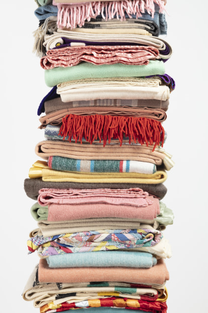 Marie Watt Blanket Story: Indian Territories, Round Dance, Grandmother, 2016 folded blankets, steel poles, wooden base 102 x 33 1/2...