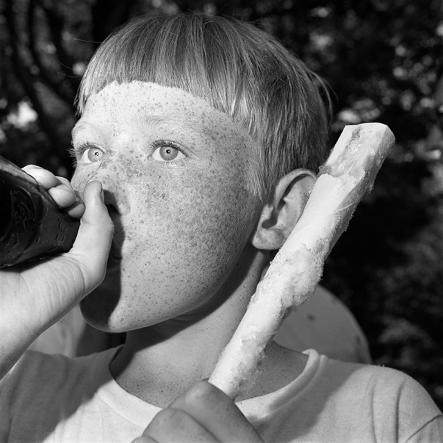 Rosalind Fox Solomon, Scottsboro, Alabama [Boy with Coke and Cotton Candy], 1976