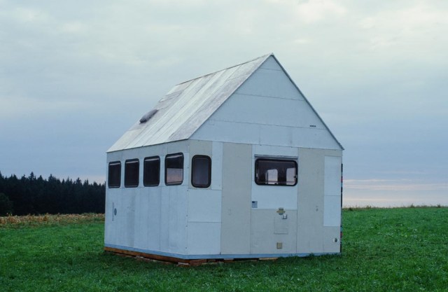 Michael Sailstorfer 'Heimatlied', 2001, 4 camper vans, wood, electricity, water, 375 x 360 x 410 cm (Courtesy of CARBON 12 and the Artist)
