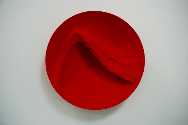 Red Wind, pigment on carved wood, 54 cm diameter