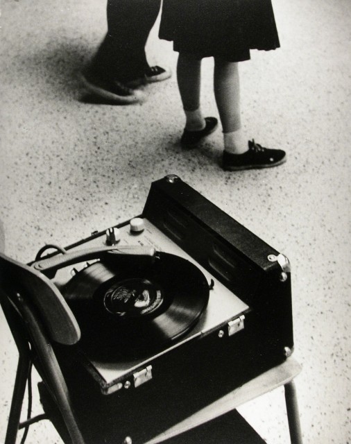 George S. Zimbel b. 1929 The Record Player, 1960 Signed, titled and dated. in pencil, au verso Printed in 2002 Gelatin silver print 16 x 12 in 40.64 x 30.48 cm