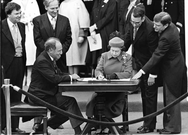 Ron Poling The Queen signs Canada’s constitutional proclamation in Ottawa on April 17, 1982 as Prime Minister Pierre Trudeau looks on Signed and dated, au verso Printed in 2013 Gelatin silver print 9 ½ x 12 ¾ inch (24.13 x 32.39 cm) image 11 x 14 inch (27.94 x 35.56 cm) paper Edition of 75