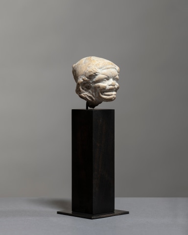 Greek grotesque head of a grimacing woman, c.3rd century BC