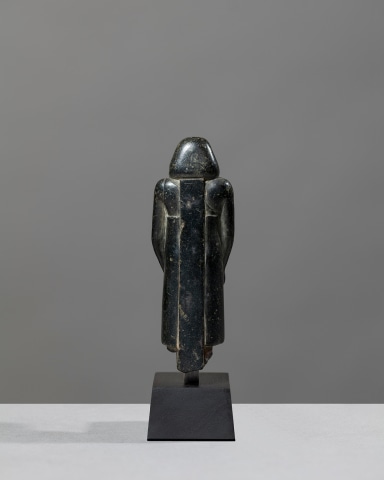 Egyptian theophorous figure, holding a seated statuette of Imhotep, Late Period, 27th-30th Dynasty, c.525-343 BC