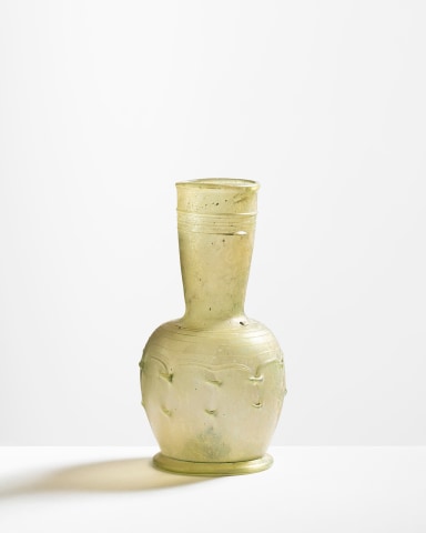 106. Late Roman-early Byzantine clear, pale olive green flask, c.6th-7th century AD