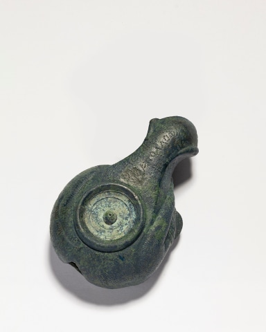 Roman oil lamp in the form of a sleeping hound, Imperial Period, c.1st century AD