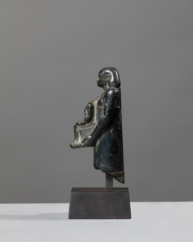 Egyptian theophorous figure, holding a seated statuette of Imhotep, Late Period, 27th-30th Dynasty, c.525-343 BC