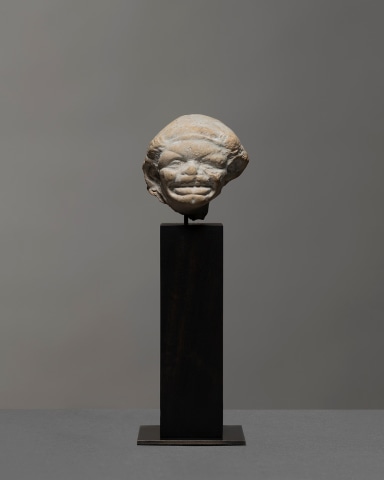 Greek grotesque head of a grimacing woman, c.3rd century BC