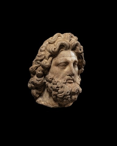 Roman head of a bearded god, c.2nd century AD