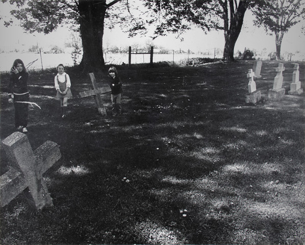 Larry Towell, Untitled [Children in a cemetery], 1974