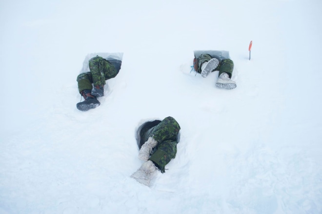 Louie Palu, Canadian soldiers in Resolute Bay, Nunavut tunneling into the side of a hill creating a shelter known as a snow cave. This is an improvised shelter for survival in extreme Arctic weather when there is limited or lack of conventional shelter like a tent available. Snow caves can be heated with a single candle, 2018