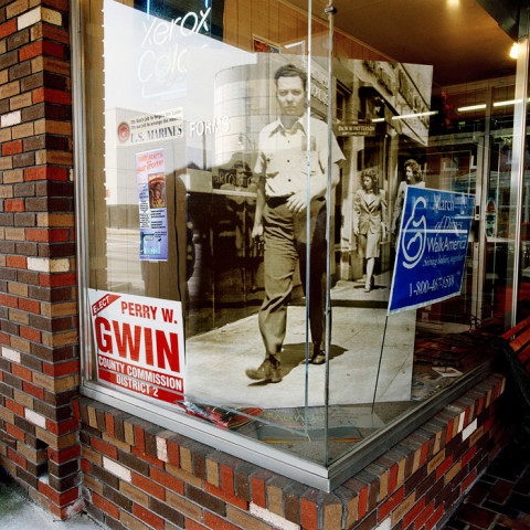 Phil Bergerson, Untitled, Gadsen, Alabama [walking man in store window], 2006