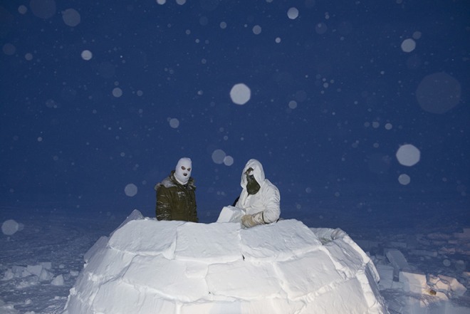 Louie Palu, Canadian soldiers on the Arctic Operations Advisors course build an igloo as an improvised survival shelter at the Crystal City training facility near Resolute Bay, Nunavut, in temperatures as low as -50 degrees Celsius (-58 F). All Canadian soldiers from the south who will operate in the Arctic must learn Inuit traditional survival techniques, 2018