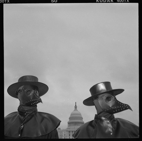 Louie Palu, Protesters dressed as plague doctors protesting disinformation at the US Capitol and Commerce Subcommittee on Communications and Technology, and the Subcommittee on Consumer Protection and Commerce held a joint hearing on "Disinformation Nation: Social Media's role in Promoting Extremism and Misinformation, 2021