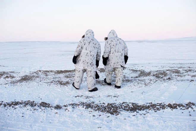 Louie Palu, Canadian Arctic Operations Advisors walk on the shore of a lake on Cornwallis Island, Nunavut. This special unit of soldiers was created to advise and support soldiers who are less experienced in the Arctic and also is mandatory for any soldiers who wish to be Ranger Instructors who work with the mostly Inuit dominated unit in the north, 2017