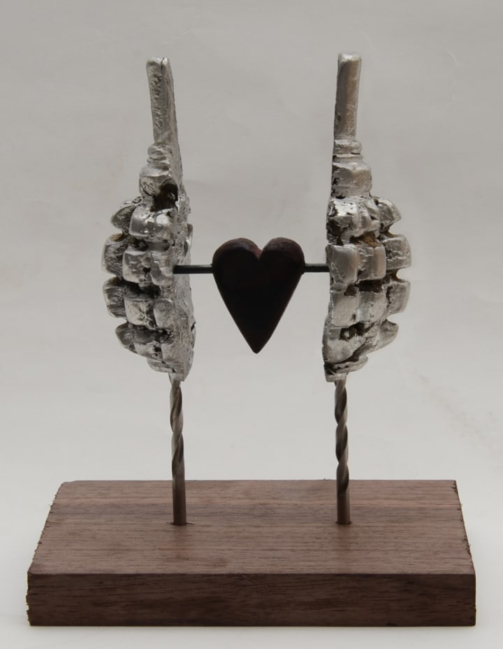 Eric Artola, The Humanity of War, aluminum and wood