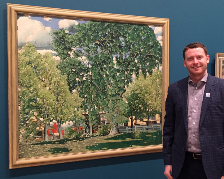 Craig Klinkhoff standing next to Marc-Aurèle Fortin's Landscape, Ahuntsic at the National Gallery of Canada, April 2018. 