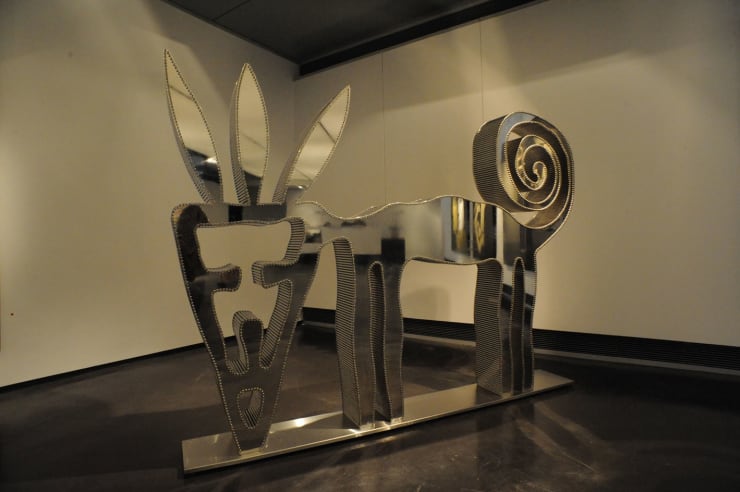 Nadim Karam Wild Cat, 2009 Super Mirror Stainless Steel Sheets and Plexiglas Cylinders 150 x 210 x 25.5 cm